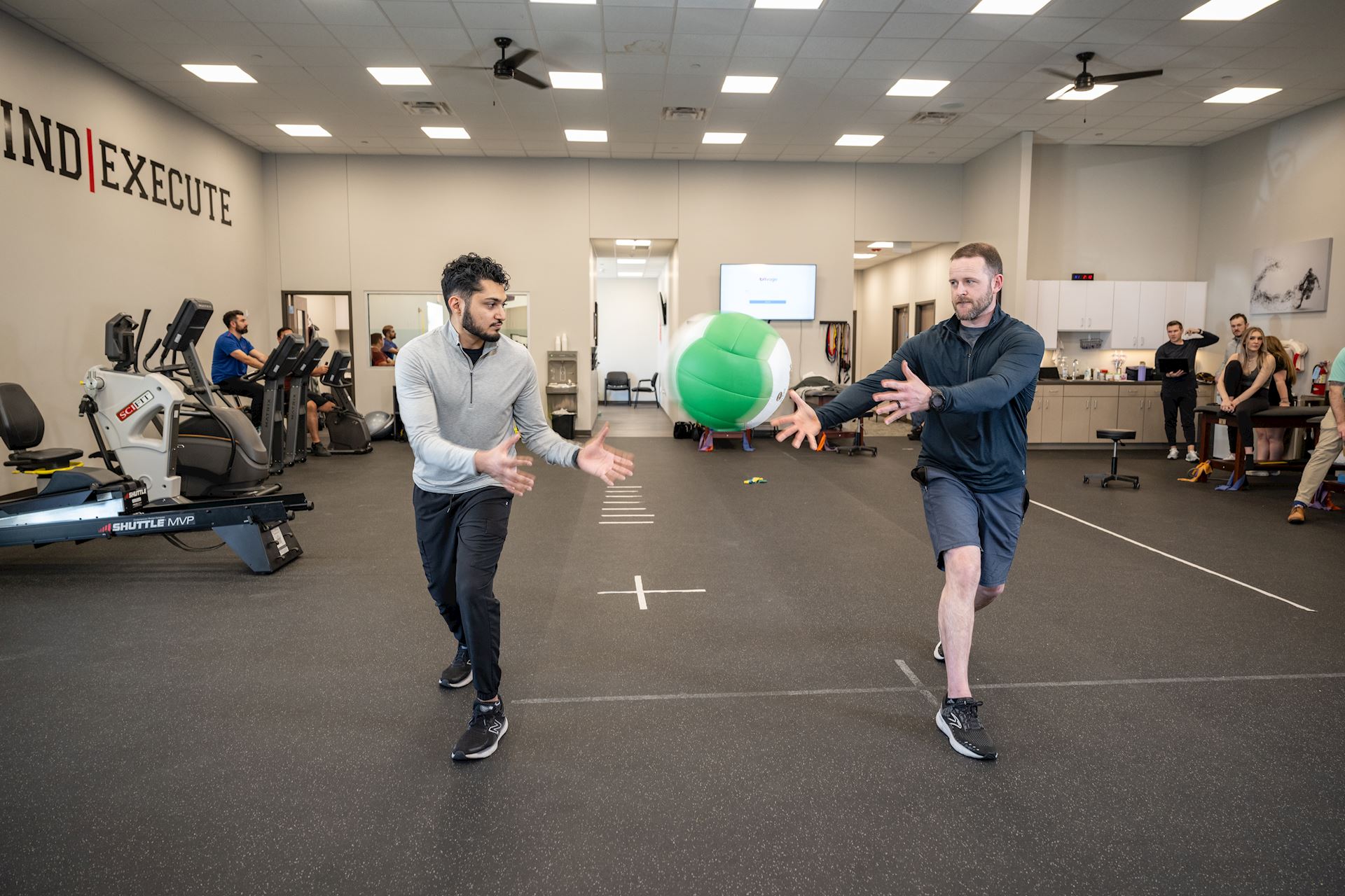 physical therapists demonstrating rehab exercise